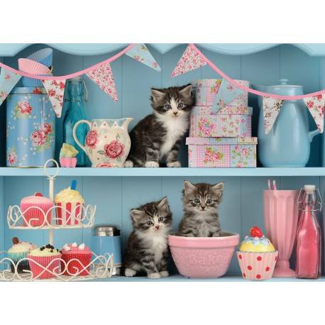 Puzle gatitos en la cocina con cupcakes